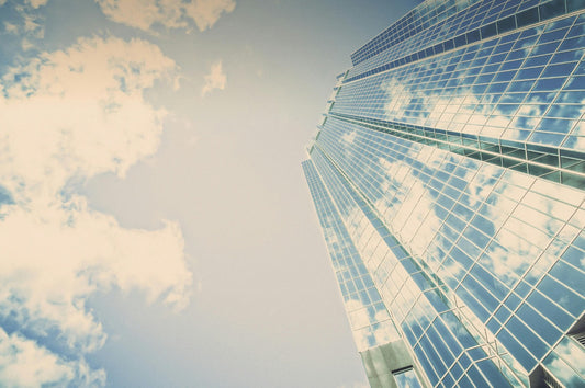 Image of tall skyscraper, meant to symbolize growth and process.