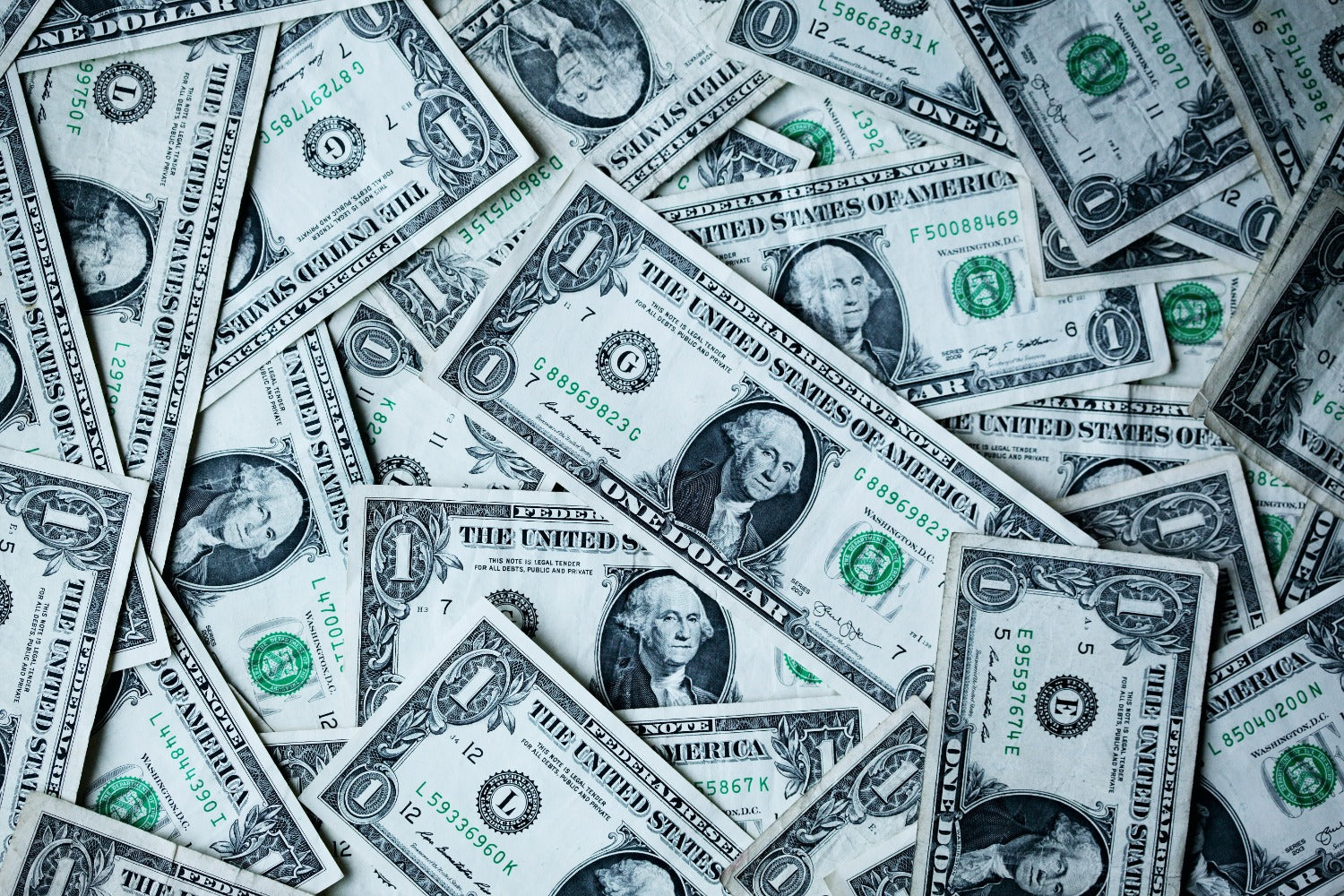 Money and revenue drivers; pile of money; how to boost revenue in your business and scale.