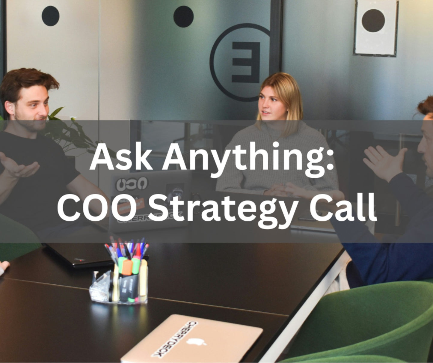 COO Strategy Call to get the business streamlined. People at a desk collaborating. 